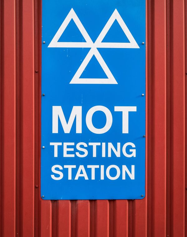 A Motor Ordinance Test (MOT) Station Sign At A Garage In The UK