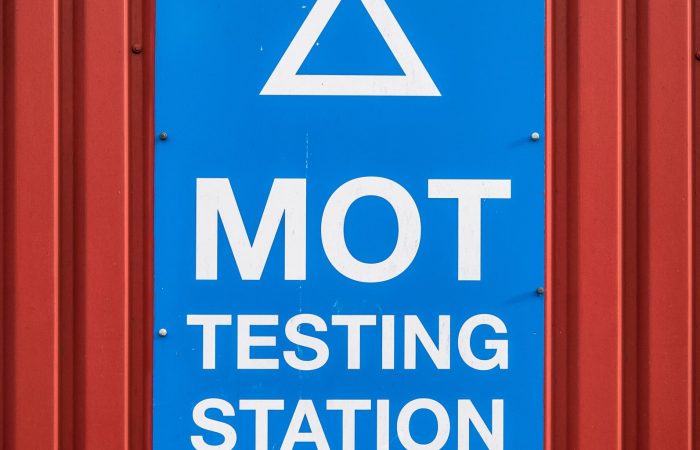 A Motor Ordinance Test (MOT) Station Sign At A Garage In The UK