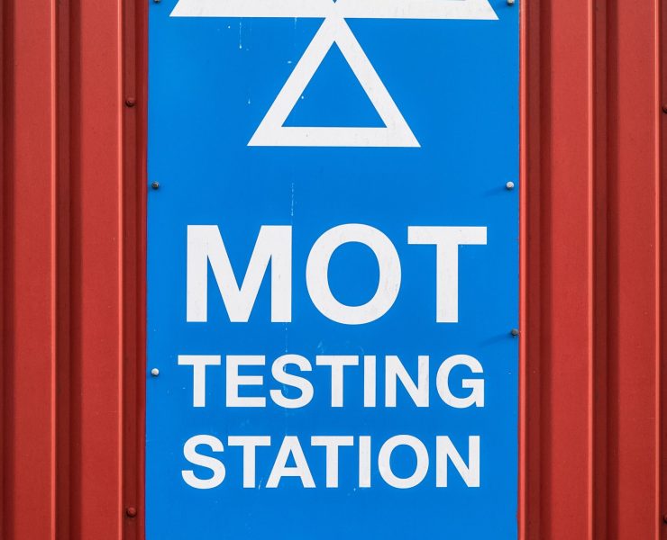 A Motor Ordinance Test (MOT) Station Sign At A Garage In The UK